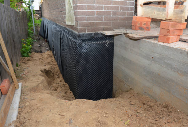 Happy homeowners after waterproofing job in Kunkle
